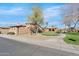 Exterior view of the home, complemented by lush landscaping and hardscape at 4528 W Valencia Dr, Laveen, AZ 85339