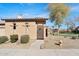 Front exterior with desert landscaping, tile roof, and a decorative front gate at 4528 W Valencia Dr, Laveen, AZ 85339