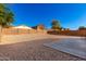 Expansive backyard with gravel and concrete and privacy block fencing at 468 E Wolf Hollow Dr, Casa Grande, AZ 85122