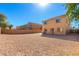 Expansive backyard featuring desert landscaping, block wall, and a patio, ideal for relaxing and entertaining outdoors at 468 E Wolf Hollow Dr, Casa Grande, AZ 85122