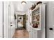 Inviting entryway showcasing stylish tile flooring and a charming built-in shelving unit at 468 E Wolf Hollow Dr, Casa Grande, AZ 85122