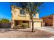 Two-story home with a two-car garage and low-maintenance desert landscaping for easy upkeep at 468 E Wolf Hollow Dr, Casa Grande, AZ 85122