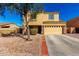 Two-story home with a two-car garage and low-maintenance desert landscaping for easy upkeep at 468 E Wolf Hollow Dr, Casa Grande, AZ 85122