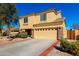 View of the home's front exterior showcasing the two car garage at 468 E Wolf Hollow Dr, Casa Grande, AZ 85122