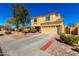 Two-story home with a two-car garage and low-maintenance desert landscaping for easy upkeep at 468 E Wolf Hollow Dr, Casa Grande, AZ 85122