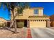 Two-story home with a two-car garage and low-maintenance desert landscaping for easy upkeep at 468 E Wolf Hollow Dr, Casa Grande, AZ 85122