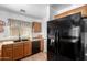 Well-lit kitchen featuring wood cabinets, modern appliances, and lots of counter space at 468 E Wolf Hollow Dr, Casa Grande, AZ 85122