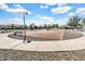 Community basketball court with benches and nearby shade trees for comfortable recreation at 4926 S Hemet St, Gilbert, AZ 85298