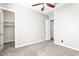 Bedroom with carpet flooring, a walk-in closet, and doorway leading to another area of the house at 4926 S Hemet St, Gilbert, AZ 85298