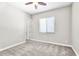 Bedroom featuring a window with blinds, carpet flooring, and a ceiling fan at 4926 S Hemet St, Gilbert, AZ 85298