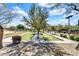 Bocce ball court with manicured landscaping, benches and trees in a community park setting at 4926 S Hemet St, Gilbert, AZ 85298