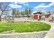 Welcoming community entrance with stone accents, lush lawn, and vibrant floral display for added curb appeal at 4926 S Hemet St, Gilbert, AZ 85298