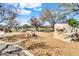 Picturesque community park featuring a small pond, playground, and natural rock formations for outdoor enjoyment at 4926 S Hemet St, Gilbert, AZ 85298