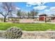 Community entrance featuring stone signage, water fountain, and lush landscaping at 4926 S Hemet St, Gilbert, AZ 85298