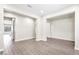 Bright, open living room featuring wood-look flooring and neutral paint at 4926 S Hemet St, Gilbert, AZ 85298