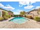 Backyard pool with blue skies and a concrete patio perfect for relaxation and outdoor enjoyment at 4926 S Hemet St, Gilbert, AZ 85298