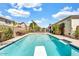 Backyard pool with diving board, and well-maintained landscaping, great for recreational fun and relaxation at 4926 S Hemet St, Gilbert, AZ 85298