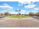 Landscaped roundabout with vibrant flowers and well-manicured greenery, enhancing the community's appeal at 4926 S Hemet St, Gilbert, AZ 85298