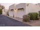 Attached two-car garage featuring white doors and manicured landscaping at 5101 N Casa Blanca Dr # 335, Paradise Valley, AZ 85253