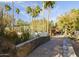 Elegant greenhouse viewed from a stone bridge and tropical foliage at 5101 N Casa Blanca Dr # 335, Paradise Valley, AZ 85253