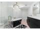 Luxurious bathroom with a freestanding tub, pink tile, and modern vanity at 5601 E Caballo Dr, Paradise Valley, AZ 85253