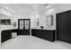 Large bathroom featuring dual vanities with brass hardware, herringbone tile, and modern fixtures at 5601 E Caballo Dr, Paradise Valley, AZ 85253