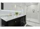 Elegant bathroom featuring double sinks, marble countertops, and a glass-enclosed shower for a luxurious feel at 5601 E Caballo Dr, Paradise Valley, AZ 85253