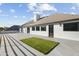 Large rooftop patio with artificial turf and views of the modern home's architecture at 5601 E Caballo Dr, Paradise Valley, AZ 85253