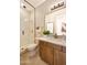 Contemporary bathroom featuring a glass-enclosed shower, stylish vanity, and elegant fixtures at 5711 S Quartz St, Gilbert, AZ 85298