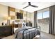 Stylish bedroom with a metal frame bed, industrial-style accents, and a modern color palette at 5711 S Quartz St, Gilbert, AZ 85298