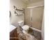 Bathroom featuring a toilet, shower, modern vanity, and stylish shelving at 5809 E Thomas Rd, Scottsdale, AZ 85251