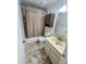 Standard bathroom featuring a shower-tub combo and vanity cabinet at 5809 E Thomas Rd, Scottsdale, AZ 85251