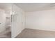 Bedroom with lattice partition, neutral carpet and access to closet at 5809 E Thomas Rd, Scottsdale, AZ 85251