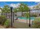 Community pool with fencing and green landscape at 5809 E Thomas Rd, Scottsdale, AZ 85251