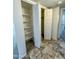 Hallway with closet doors and tile flooring at 5809 E Thomas Rd, Scottsdale, AZ 85251