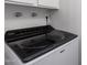 Modern, front-load washing machine in a bright laundry room at 5809 E Thomas Rd, Scottsdale, AZ 85251