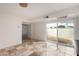 Bonus room featuring tile floors, sliding glass doors, a modern ceiling fan and neutral paint at 5809 E Thomas Rd, Scottsdale, AZ 85251