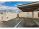 Exterior building view of parking area with covered parking and on-site storage at 5809 E Thomas Rd, Scottsdale, AZ 85251