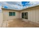 Enclosed patio with concrete flooring, greenery, and slider access to the home's interior at 5809 E Thomas Rd, Scottsdale, AZ 85251