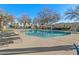 Beautiful community pool with lounge chairs and mature trees surrounding the area at 5809 E Thomas Rd, Scottsdale, AZ 85251