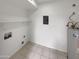 Clean laundry room with white walls, tile flooring, and modern utility connections at 633 W Southern Ave # 1115, Tempe, AZ 85282