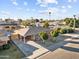 Aerial view of a charming single-story brick home with a covered carport and nicely landscaped yard at 6808 N 33Rd Ave, Phoenix, AZ 85017