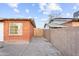 Cozy backyard featuring a classic brick wall and a wooden gate leading to a private outdoor space at 6808 N 33Rd Ave, Phoenix, AZ 85017