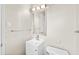 Bright bathroom featuring a modern vanity with a framed mirror and updated fixtures at 6808 N 33Rd Ave, Phoenix, AZ 85017