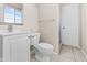 Bathroom featuring a modern toilet, sink, vanity and tile floors at 6808 N 33Rd Ave, Phoenix, AZ 85017