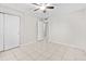 Bedroom with tile floors, ceiling fan, and closet at 6808 N 33Rd Ave, Phoenix, AZ 85017