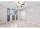 Bedroom with tile floors, ceiling fan, and a closet with sliding doors at 6808 N 33Rd Ave, Phoenix, AZ 85017