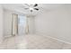 Spacious bedroom featuring tile floors, ceiling fan, and neutral colors at 6808 N 33Rd Ave, Phoenix, AZ 85017