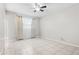 Bedroom with tile floors, ceiling fan, neutral colors, and natural light at 6808 N 33Rd Ave, Phoenix, AZ 85017