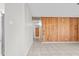 Hallway with wood paneled wall with a tile floor at 6808 N 33Rd Ave, Phoenix, AZ 85017